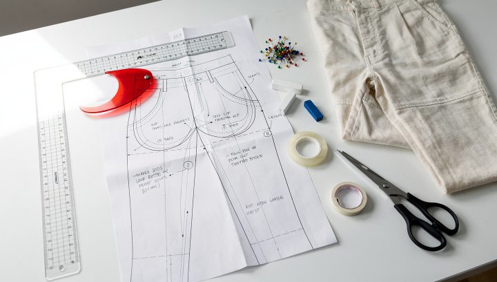 Pattern adjustment tutorial showing pant sewing pattern pieces, fit adjustments, tracing tools, and muslin fitting notes